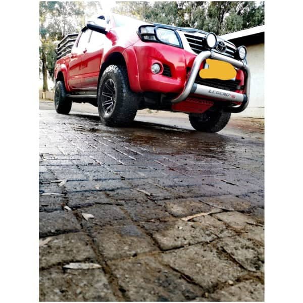 Toyota Hilux 4x4 off-road vehicle with front bull bar, rugged tires, and upgraded suspension for off-road adventures.
