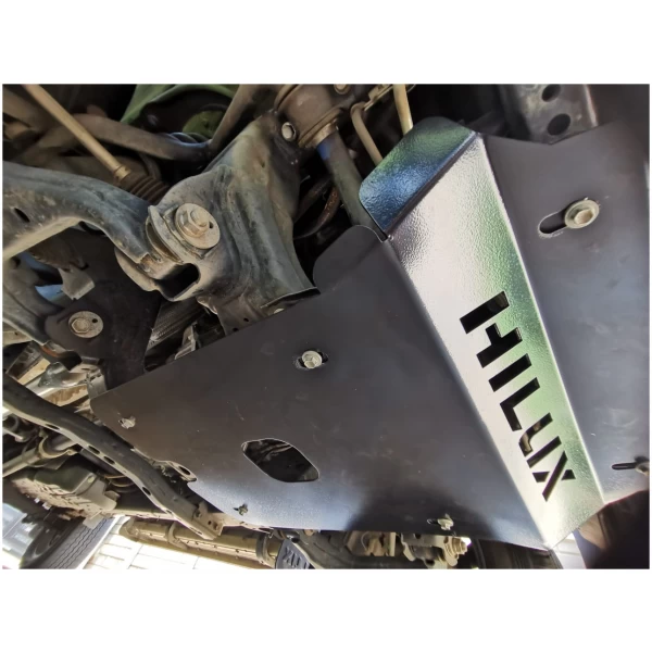 Heavy-duty black underbody protection skid plate for Toyota Hilux, off-road vehicle accessories.