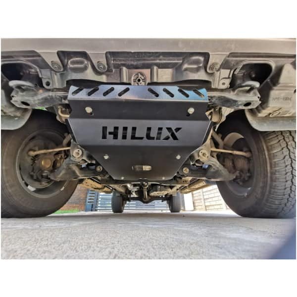 Underbody protection plate with "HILUX" branding for Toyota Hilux off-road vehicles. Designed for durability and enhanced vehicle protection.