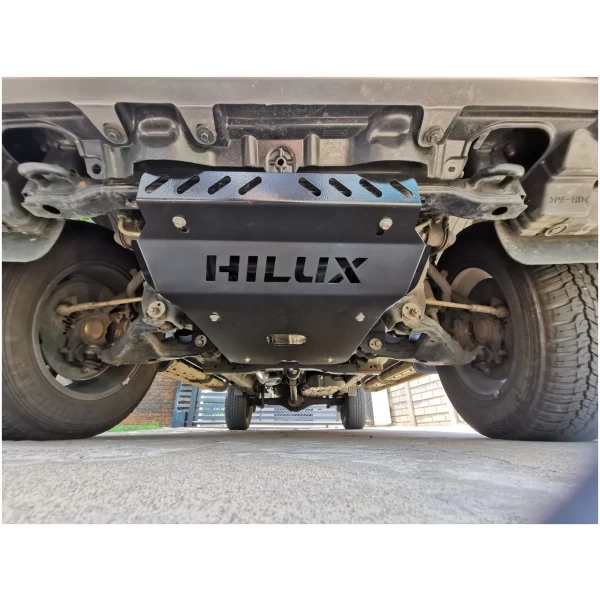 Underbody protection plate with "HILUX" branding for Toyota Hilux off-road vehicles. Designed for durability and enhanced vehicle protection.