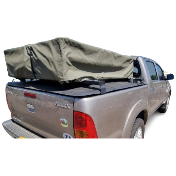 Durable off-road canopy cover on a silver Isuzu pickup truck for 4x4 adventure trips.