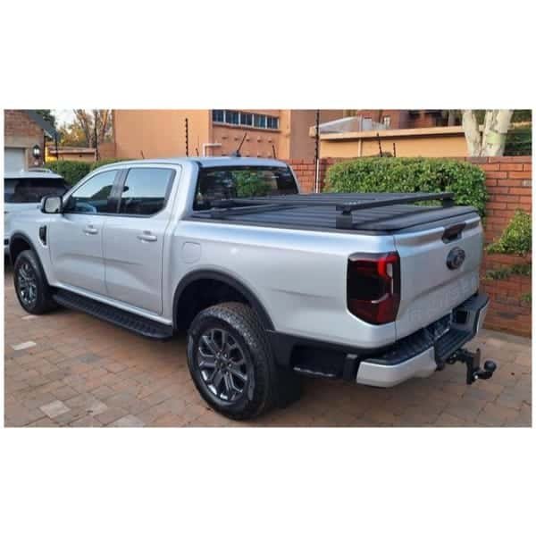 Ford Ranger 4x4 pickup truck in silver with off-road accessories for adventure and durability.