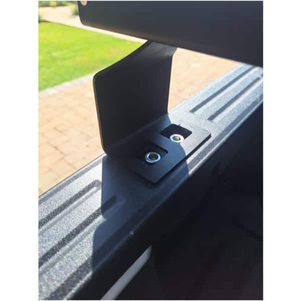 Heavy-duty roof rack mounting points for 4x4 accessories on a tough vehicle rooftop, ideal for off-road adventures.